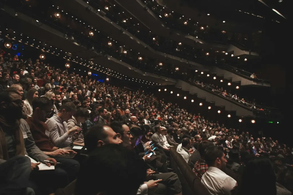 A theater full of attendees during an SEO conference.