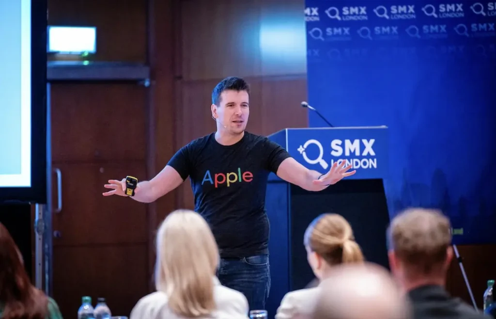 A photo of a speaker during an SMX London conference.